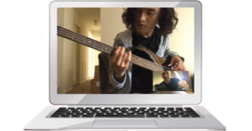 Student taking online guitar lesson